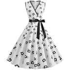 Robe rétro femme à pois – Col V et jupe évasée