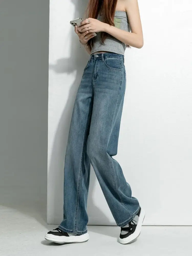 Women's vintage wide-leg jeans, loose straight cut, high-waisted, slimming, petite-friendly, with a drapey, floor-length design