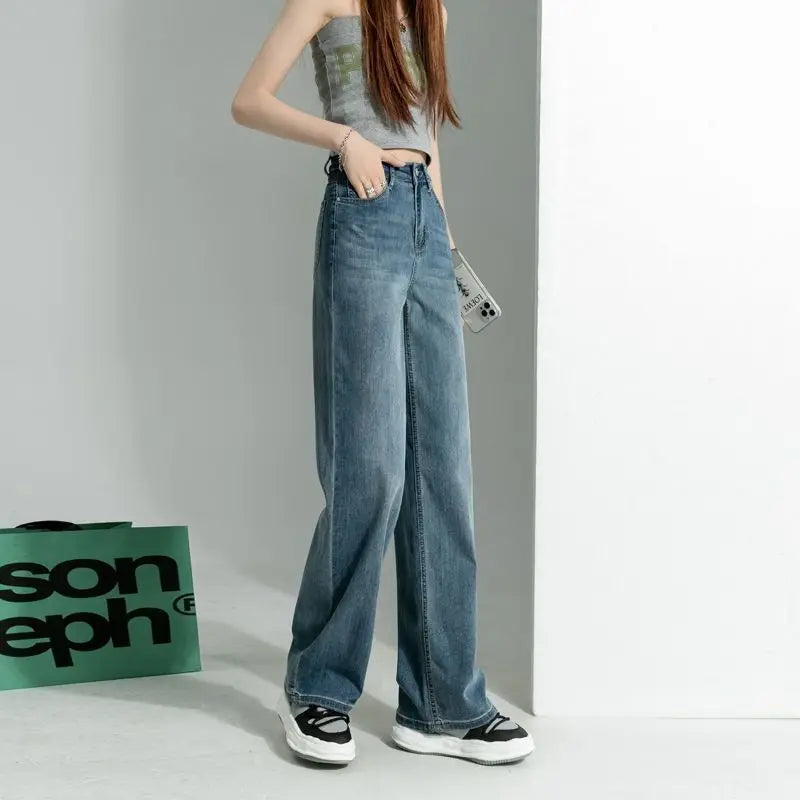 Women's vintage wide-leg jeans, loose straight cut, high-waisted, slimming, petite-friendly, with a drapey, floor-length design