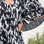 Blouse femme imprimée – Col V et détails boutonnés