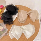Barrette à grand nœud vaporeux – Voiles superposés