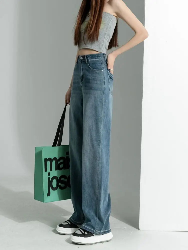 Women's vintage wide-leg jeans, loose straight cut, high-waisted, slimming, petite-friendly, with a drapey, floor-length design